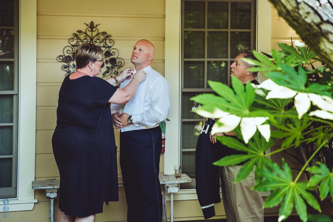 The Groom and his parents in front of the School House Suites at Madrona Manor.