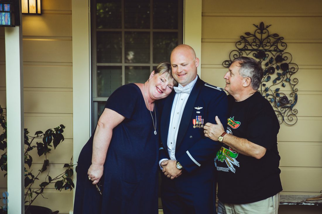 The Groom and his parents in front of the School House Suites at Madrona Manor.