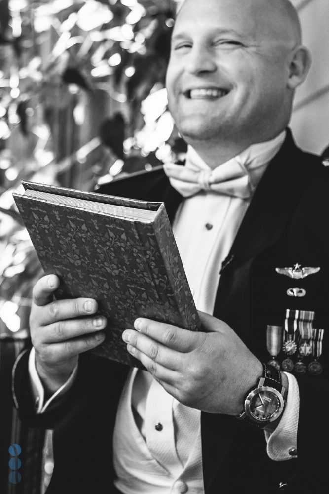 The Groom, Chris, receiving a gift from the bride.