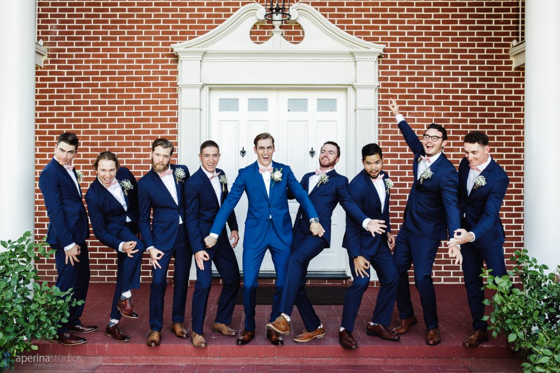 Grace Vineyards Winery Wedding Photographer - groomsmen and groom in navy blue tuxedo