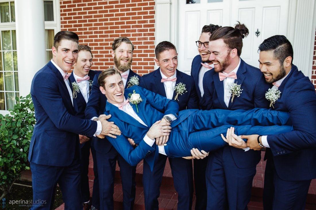 Grace Vineyards Winery Wedding Photographer - groomsmen and groom in navy blue tuxedo