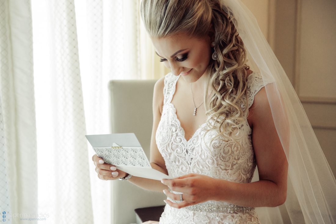 Grace Vineyards Winery Wedding Photos - bride reading note