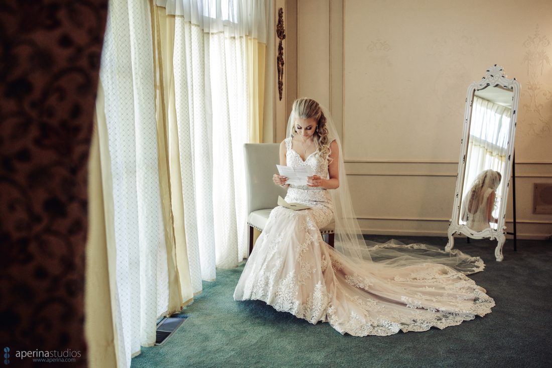 Grace Vineyards Winery Wedding Photos - bride reading note