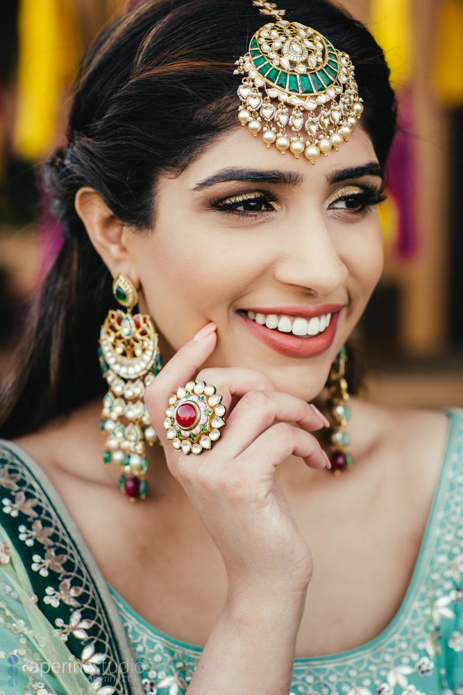 Indian Bride wearing stunning blue and green Anita Dongre lehenga on her Sangeet