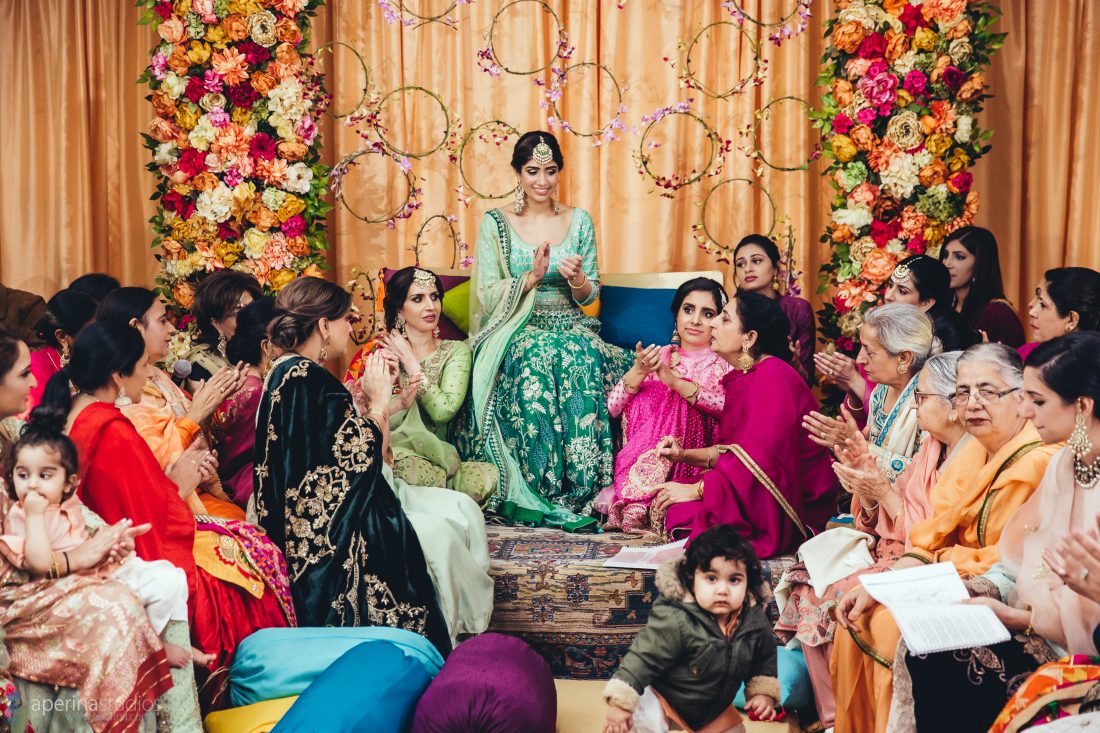 Bride and her family on the wedding Sangeet - Vibrant Tent Sangeet - Indian Wedding Photography