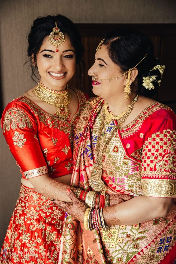 Indian wedding photography - Bride getting ready in red lehenga dress
