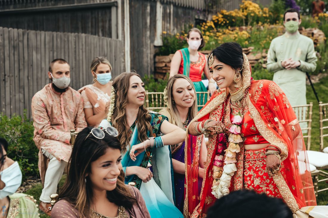 Denver Indian Wedding Photography by Aperina Studios - beautiful Hindu ceremony moments with Red, white and pink color scheme.